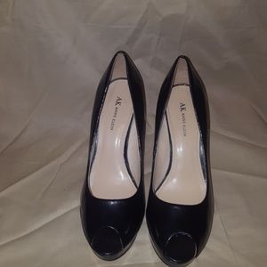 navy blue patent leather high heeled shoes